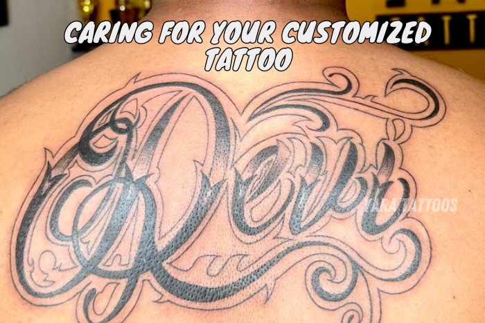 Back tattoo with bold, intricate design by Yaara Tattoos in Coimbatore, featuring the name 'Deva'. Expertly crafted customized tattoo, highlighting the quality of tattoo art services provided. Learn more about caring for your customized tattoo from our experienced tattoo artists at Yaara Tattoos in Coimbatore