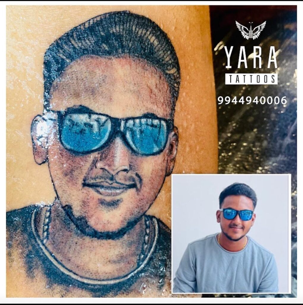 The image shows a realistic colorful human face portrait tattoo.
