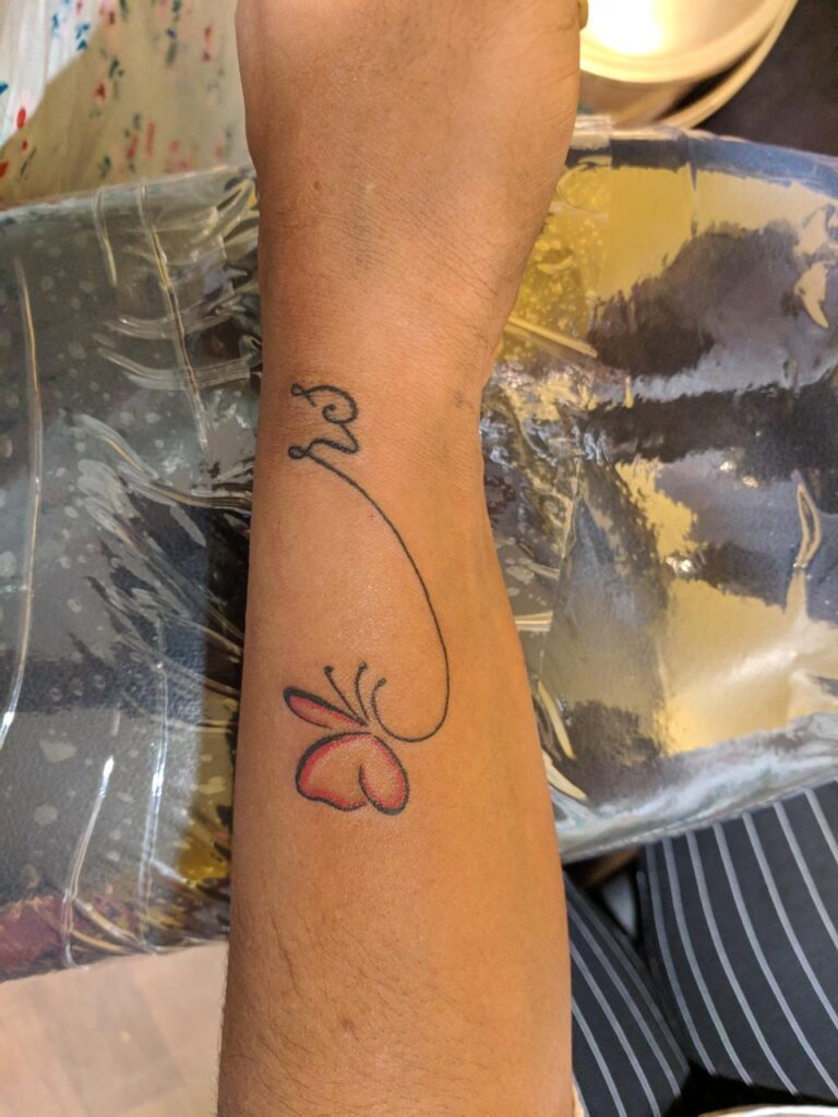 The image shows a cute little butterfly in red and black shade, along with initials “rs” in a handwritten font.